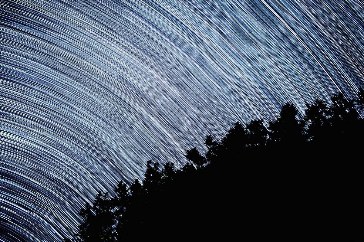 starry night time-lapse photography of sky light star trails